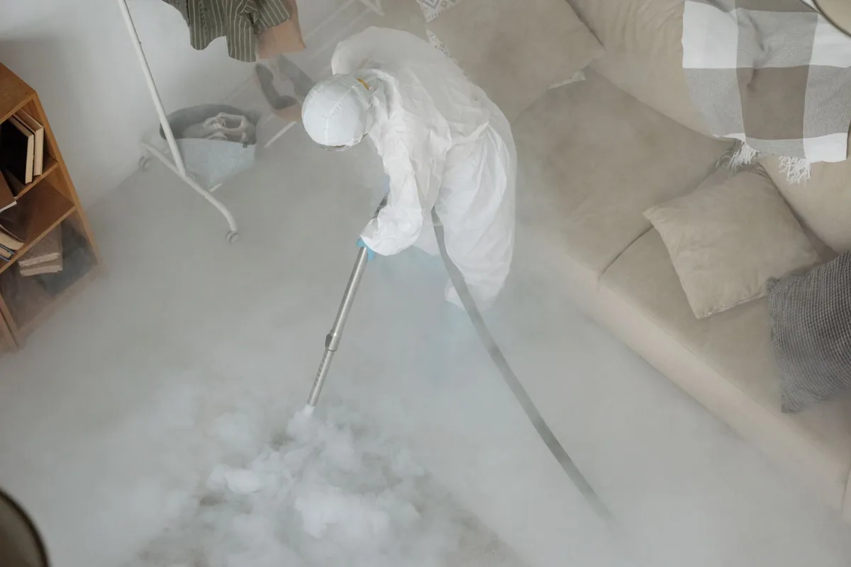 Biohazard cleanup technician in protective equipment, Dayton, TN